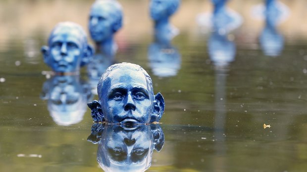 "Where the Tides Ebb and Flow" installation of 35 blue clone sculptures by Argentine artist Pedro Marzorati at the Park Montsouris in Paris. The artwork illustrates the theme of rising sea levels due to global warming.