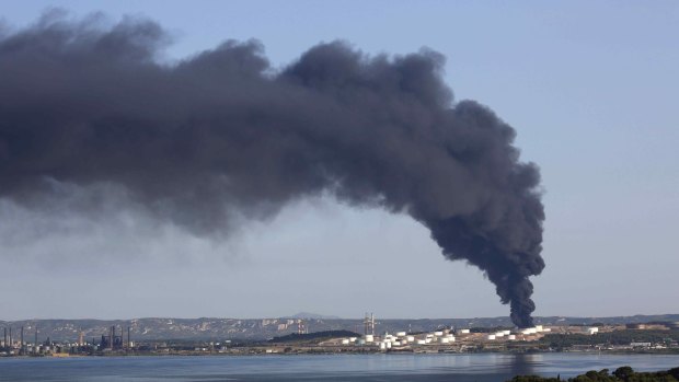 Smoke billows into the sky from one of two fires that started on a petrochemical facility near Marseille, southern France on Tuesday.