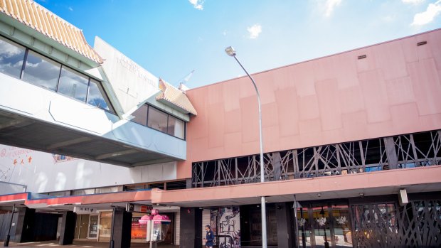 The boarded-up ground floor escalators and walkway between the Fortitude Valley train station to McWhirter's.