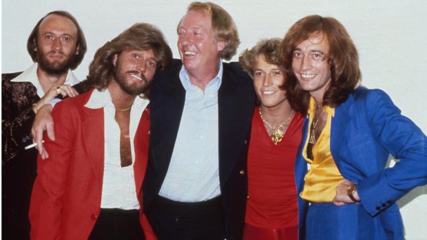 The Bee Gees: brothers Maurice Gibb, Barry Gibb, manager Robert Stigwood, Andy Gibb and Robin Gibb in New York, 1979.