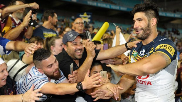 Saying farewell: James Tamou celebrates with fans after victory in the 2015 NRL grand final.