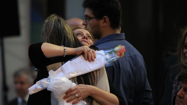 Survivors of the Lindt Cafe siege support each other at the fist anniversary in Martin Place.