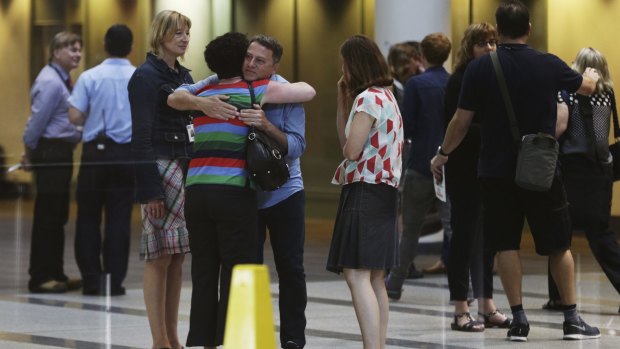 ABC staff embrace at ABC studios in Ultimo after a meeting held by ABC
CEO Mark Scott announcing widespread staff cuts in November.