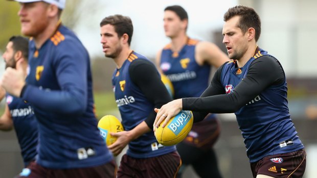 Luke Hodge and Jarryd Roughead were among a group of Hawks players whose flight to Perth was delayed.