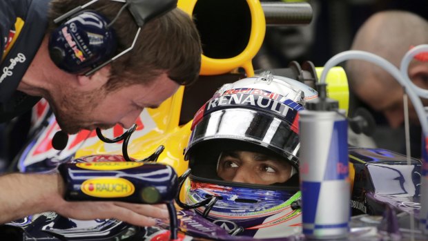 Bullish: Daniel Ricciardo talks to his crew during practice on Friday for Sunday's Malaysian Grand Prix.