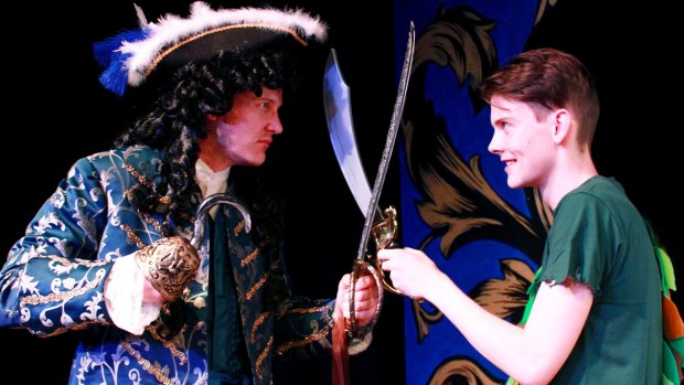 Greg Sollis, left, as Hook and Josh Kirk as Peter Pan clash in Ickle Pickle's  <i>Peter Pan the Musical</i>.