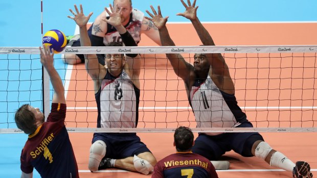 Germany and the USA in action during a Sitting Volleyball match at the Rio 2016 Paralympic Games.