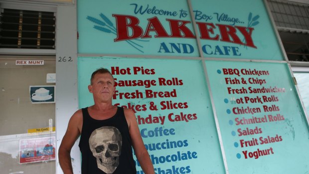 Ross Paull, standing outside the Box Village Bakery and Cafe, said his family also became ill.