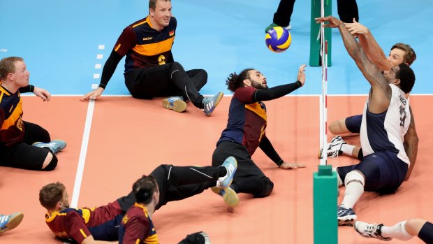 The German and USA teams in action during a Sitting Volleyball match at the Rio 2016 Paralympic Games.