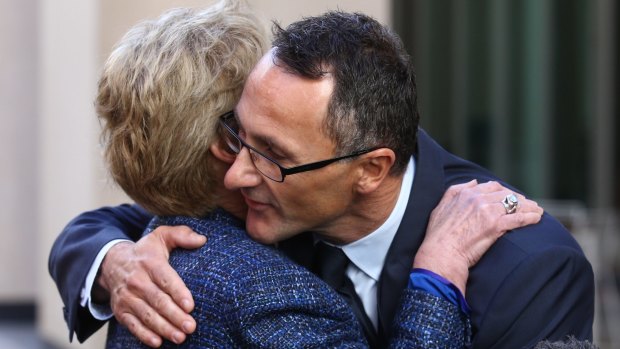 Former Greens leader Senator Christine Milne embraces new Greens leader Senator Richard Di Natale.