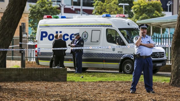 Police cordon off a crime scene after the discovery of a body in Wentworth Park.