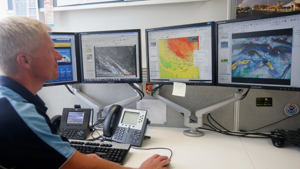 MELBOURNE, AUSTRALIA - JANUARY 01: The bureau of meteorology desk at the State control centre on January 1, 2015 in Melbourne, Australia. (Photo by Darrian Traynor/Fairfax Media)