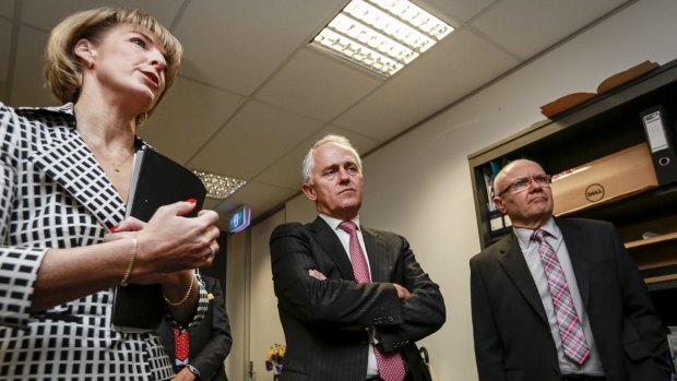 Prime Minister Malcolm Turnbull, Minister for Women Michaelia Cash and chairman of the Advisory Panel on Reducing Violence against Women and their Children Ken Lay.