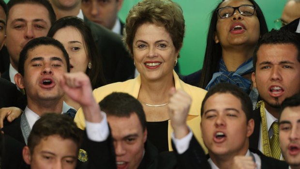 Dilma Rousseff poses for pictures with young professionals at Planalto presidential palace in Brasilia, Brazil on September 2.