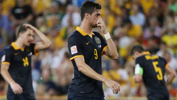 Australia's James Troisi, Tomi Juric and Mark Milligan react after a missed opportunity during the game against South Korea in Brisbane on Saturday.