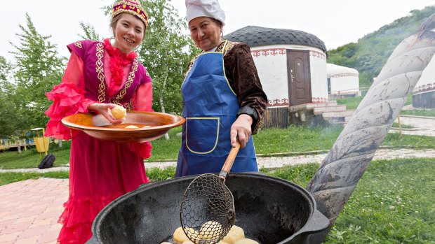 Kazakh women make traditional local bread known as Baursak in Almaty.