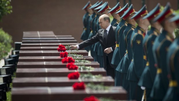Russian President Vladimir Putin lays flowers at the Tomb of the Unknown Soldier in Moscow, on Monday to mark the 74th anniversary of the Nazi invasion of the Soviet Union. 