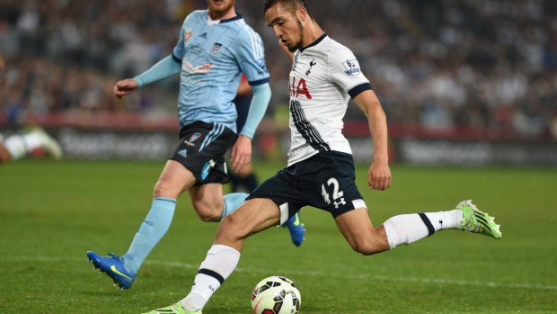 Left boot to ball: Nabil Bentaleb lets rip against Sydney FC at ANZ Stadium.
