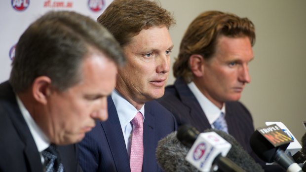 Essendon's then chairman David Evans, centre, with chief executive Ian Robson, left, and coach James Hird in February 2013.