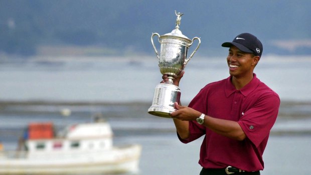 Glory days: Woods shows off the winner's trophy for the US Open of 2000 - a watershed year for the former world No.1.