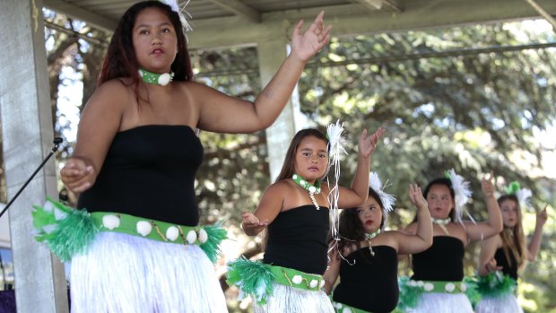 Phillinah Utia, 14, of Queanbeyan, right, and Eleni Lolesio, 9, second from right, performing with Te Uki Ou O Te Kuki Airani (The New Generations of Cook Island) dancers at Waitangi Day celebrations in Queanbeyan.   