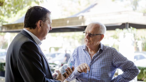 Greater Western Sydney chief operating officer Richard Griffiths speaks to resident John Nutt at Manuka earlier this month.