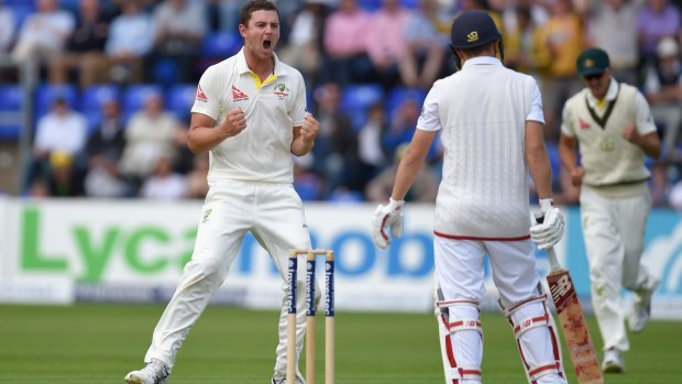 Having a rest: Australia's Josh Hazlewood celebrates trapping England's Gary Ballance leg-before just after tea on day one of the first Ashes Test in Cardiff.