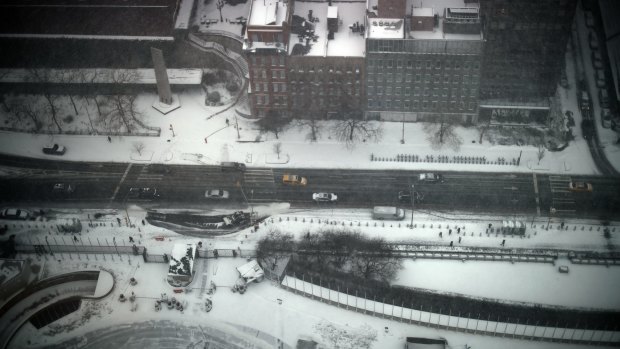 View from above: The streets empty of traffic as the storm bears down.