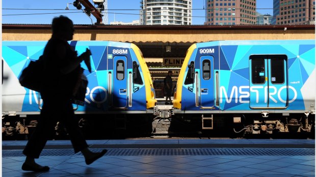 Metro trains and Flinders St rail station. 