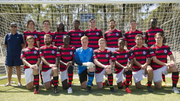 Woden-Weston FC wearing their new red and black jersey before playing in a pre-season game against ANU in the State League.
