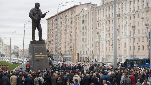 A new monument to Russian firearm designer Mikhail Kalashnikov is unveiled in Moscow on Tuesday.