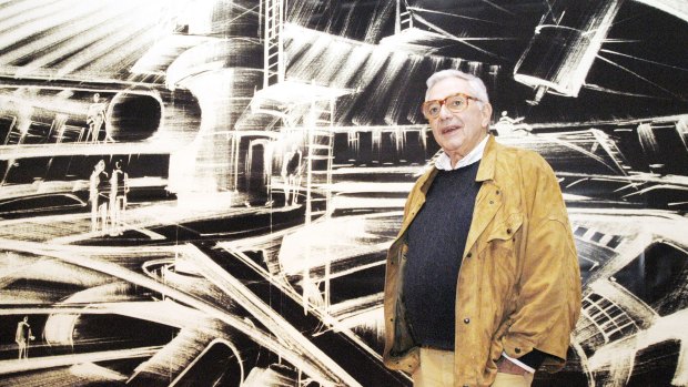 Ken Adam stands in front of one of his futuristic designs at the exhibition James Bond – Berlin – Hollywood in Berlin in 2002.