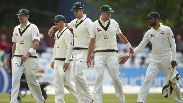 Leading from the front: David Warner, with Shane Watson, Mitch Marsh, Peter Siddle and Fawad Ahmed celebrate after bowling out Derbyshire during day three.