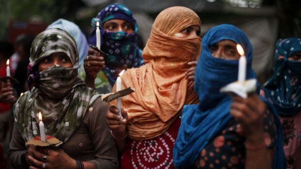 Protest after the gang rape of two teenage girls in New Delhi in 2014.