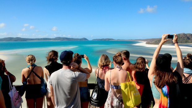 Post-cyclone Debbie: Tourists lined up to take photographs of Hill Inlet and Whitehaven Beach.