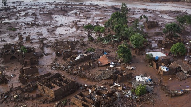 Homes lay in ruins after two dams burst on Thursday, flooding the small town of Bento Rodrigues, Brazil.