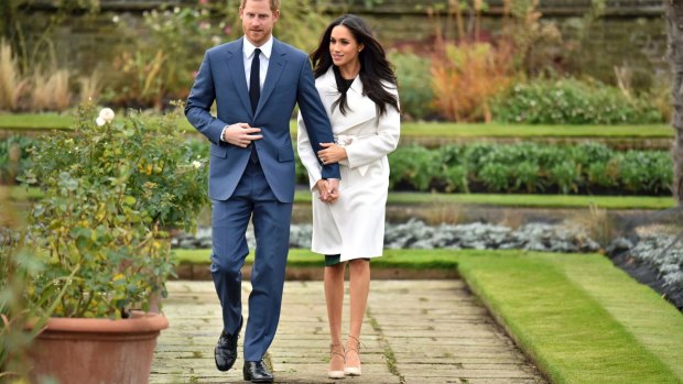 Britain's Prince Harry and Meghan Markle pose for photos following their engagement announcement.