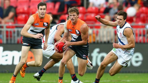 Will Hoskin-Elliott (centre) appears likely to stay with the Giants.