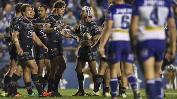 Highs and Lowes: Johnathan Thurston congratulates Ethan Lowe on one of his two tries at Belmore.