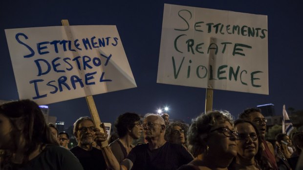 Israelis march for an end to violence in Tel Aviv on Saturday.