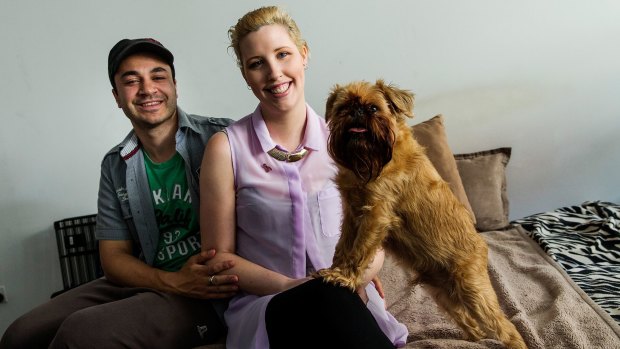 Breast cancer survivor Joanne Maillet with her husband Marcus and dog Elvis at home in South Yarra.