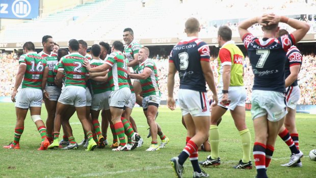 Rabbitohs run riot: South Sydney players celebrate after Hymel Hunt scored a try during the round one clash with the Sydney Roosters.