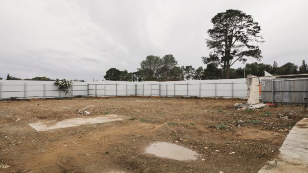 The site of the fire was bulldozed just before Christmas, and a corrugated iron fence was erected.