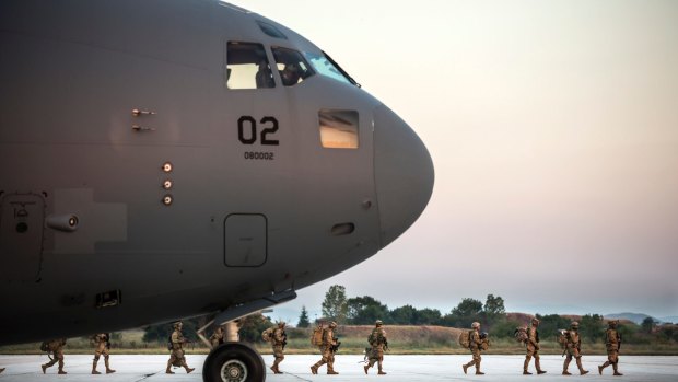 A Boeing C-17 Globemaster delivers Stryker vehicles and Humvees at Bezmer Airbase in Bulgaria.
