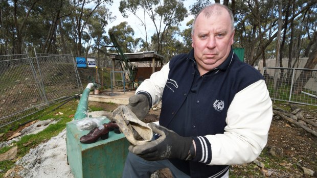 Daryl Floyd has found a shoe during a mine search for his brother's body. .