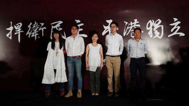 Five candidates who have been rejected to participate in the Legislative Council elections, from left: Nakade Hitsujiko, Edward Leung, Alice Lai, Andy Chan Ho-tin and James Chan Kwok-keung, attend a rally outside the Hong Kong government headquarters on August 5.