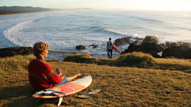 Surfers take to the empty perfect beaches along the Coffs Coast.