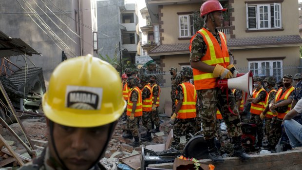 The Nepalese Army working on a collapsed house in Kathmandu on Tuesday.