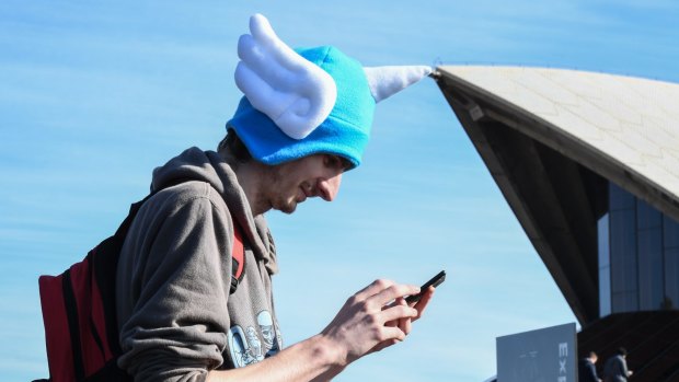 A Pokemon fan on the hunt around Sydney.