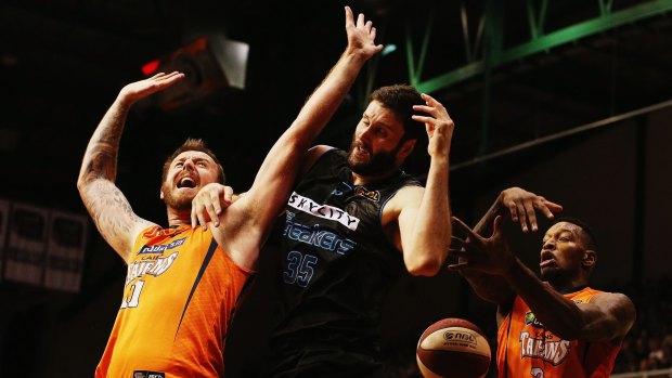 Banging bodies: Cairns forward Cameron Tragardh and Breakers counterpart Torrey Craig during game two of the NBL Grand Final series in March.